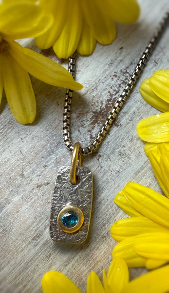 Mini Vertice with London Blue Topaz set in 18k gold.